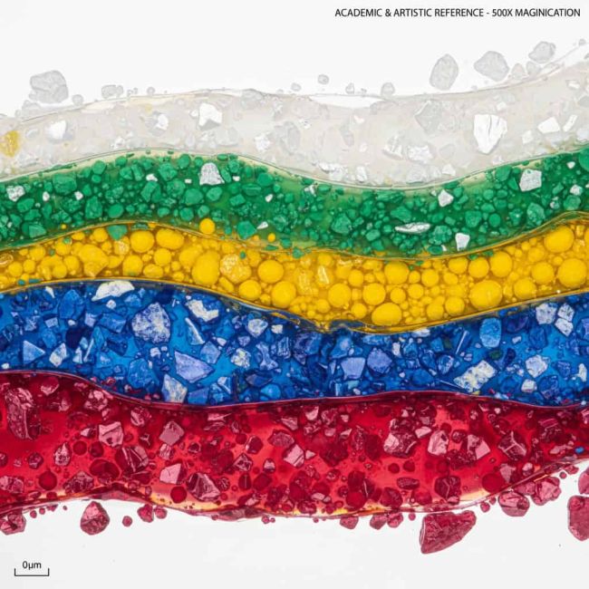Microscopic view of oil paint cross-section showing pigment distribution
